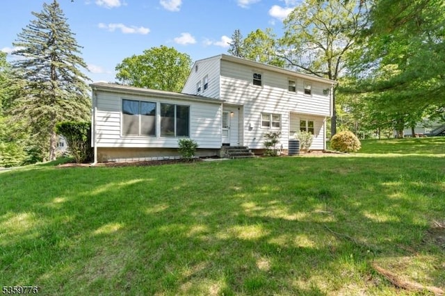 185 Ann St, Dover Town, NJ 07801 - rear view of property with entry steps and a yard