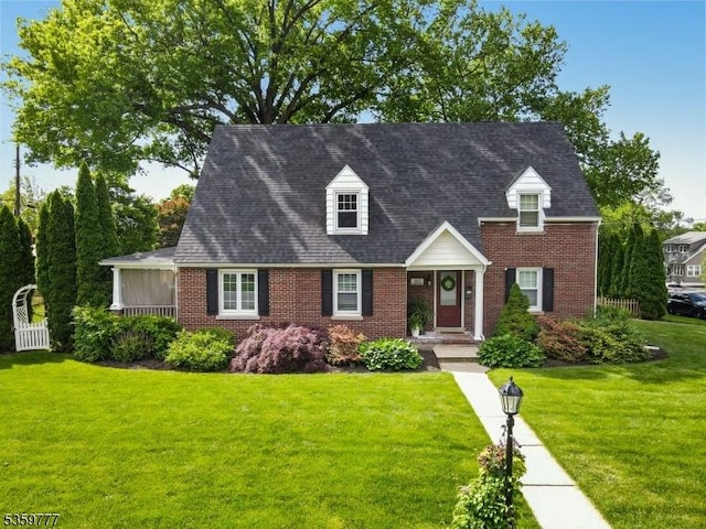 303 March Blvd, Pohatcong Twp, NJ 08865 - cape cod home with brick siding and a front lawn