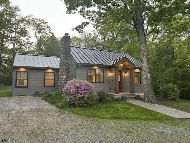 24 Lakeview Point Ave, Frankford Twp, NJ 07826 - view of front of home with a standing seam roof, a chimney, and metal roof