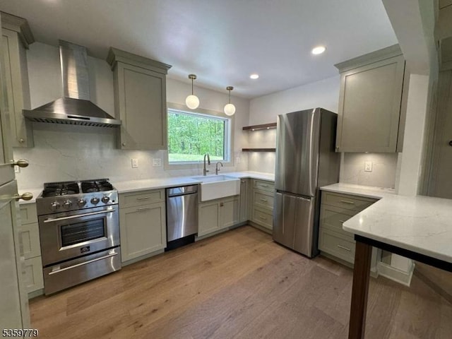 24 Lakeview Point Ave, Frankford Twp, NJ 07826 - kitchen with appliances with stainless steel finishes, wall chimney exhaust hood, a sink, light wood-style flooring, and decorative backsplash