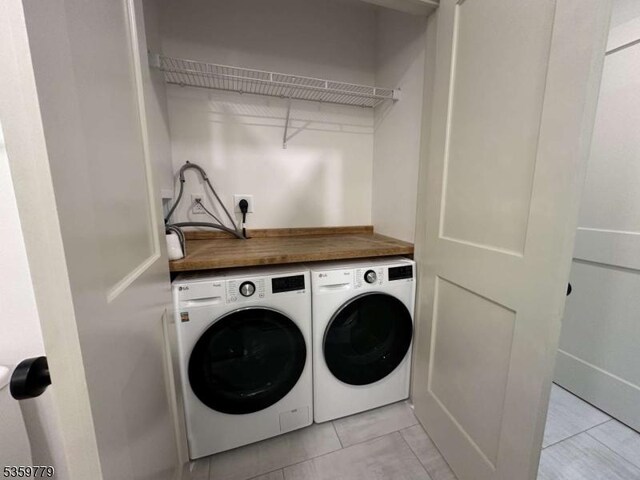 24 Lakeview Point Ave, Frankford Twp, NJ 07826 - washroom with separate washer and dryer and light tile patterned floors