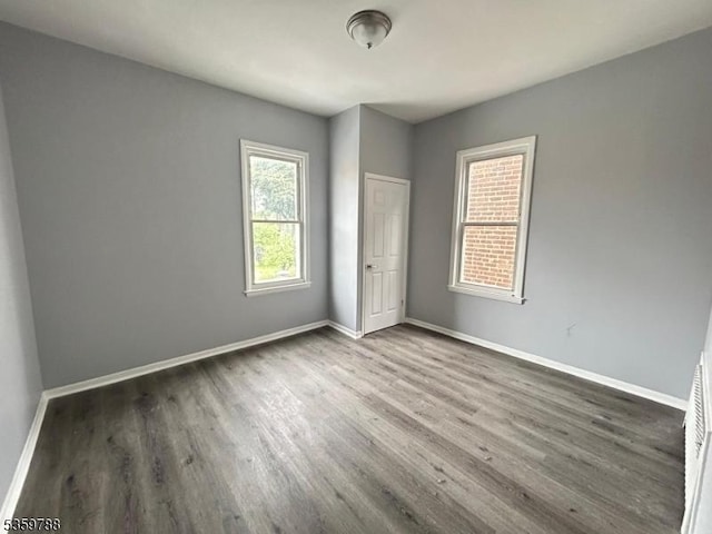 207 Tremont Ave, East Orange City, NJ 07018 - unfurnished bedroom with wood finished floors and baseboards