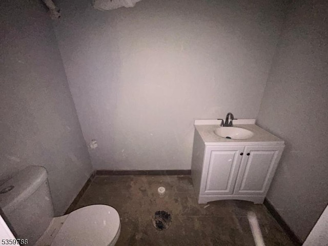 207 Tremont Ave, East Orange City, NJ 07018 - bathroom featuring toilet, vanity, and baseboards