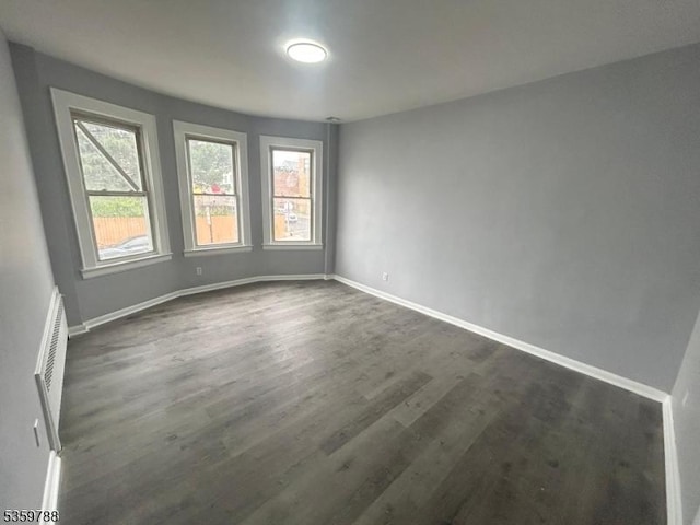207 Tremont Ave, East Orange City, NJ 07018 - unfurnished room with dark wood-type flooring and baseboards