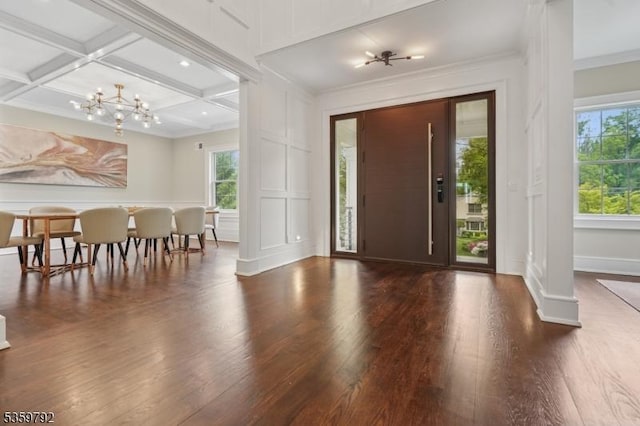 290 Long Hill Dr, Millburn Twp, NJ 07078 - entrance foyer with a decorative wall, healthy amount of natural light, wood finished floors, a chandelier, and crown molding