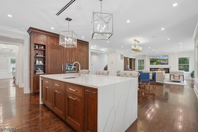 290 Long Hill Dr, Millburn Twp, NJ 07078 - kitchen featuring crown molding, dark wood finished floors, decorative light fixtures, recessed lighting, and a center island with sink