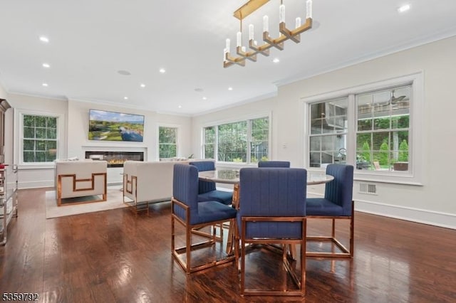 290 Long Hill Dr, Millburn Twp, NJ 07078 - dining room featuring crown molding, dark wood-style floors, plenty of natural light, recessed lighting, and a glass covered fireplace