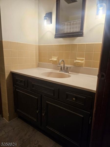 38 Summerfield Rd, White Twp, NJ 07823 - bathroom featuring tile walls, vanity, and tile patterned floors
