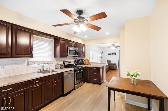 2903 Grasselli Ave, Linden City, NJ 07036 - kitchen with stainless steel appliances, a sink, tasteful backsplash, ceiling fan, and dark brown cabinets