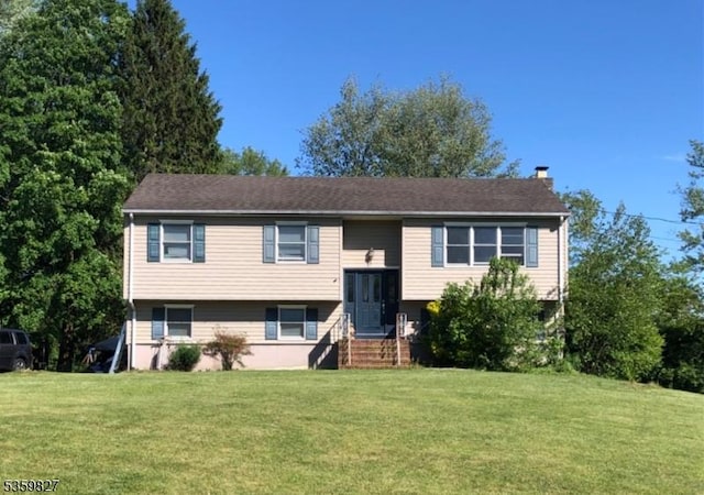 13 Elmwood Dr, Mansfield Twp, NJ 07840 - split foyer home featuring a chimney and a front yard