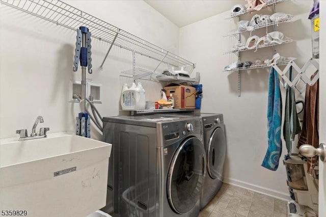 2420 Canterbury Ln, North Brunswick Twp, NJ 08902 - laundry room featuring washing machine and clothes dryer and baseboards