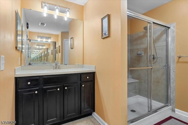 2420 Canterbury Ln, North Brunswick Twp, NJ 08902 - bathroom featuring a shower stall, vanity, baseboards, and tile patterned flooring