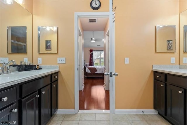 2420 Canterbury Ln, North Brunswick Twp, NJ 08902 - bathroom featuring vanity, baseboards, connected bathroom, and tile patterned floors