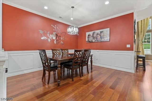 2420 Canterbury Ln, North Brunswick Twp, NJ 08902 - dining area featuring wood finished floors, ornamental molding, recessed lighting, wainscoting, and a chandelier