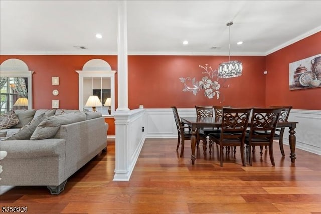 2420 Canterbury Ln, North Brunswick Twp, NJ 08902 - dining space with crown molding, light wood-type flooring, a wainscoted wall, ornate columns, and recessed lighting
