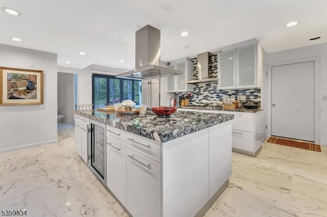 41 Park Way W, Orange Twp, NJ 07052 - kitchen featuring island exhaust hood, beverage cooler, white cabinets, backsplash, and modern cabinets