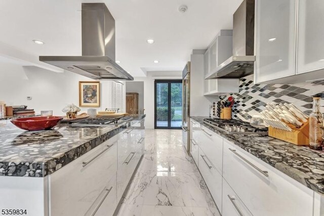 41 Park Way W, Orange Twp, NJ 07052 - kitchen featuring island range hood, wall chimney range hood, stainless steel gas stovetop, backsplash, and recessed lighting