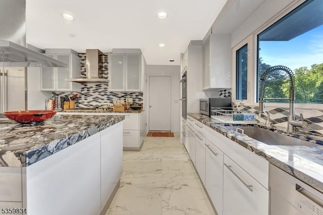 41 Park Way W, Orange Twp, NJ 07052 - kitchen featuring a sink, wall chimney range hood, decorative backsplash, dark stone countertops, and recessed lighting