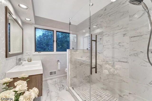 41 Park Way W, Orange Twp, NJ 07052 - bathroom with a marble finish shower, vanity, marble tiled flooring, toilet, and recessed lighting