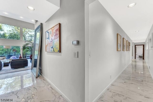 41 Park Way W, Orange Twp, NJ 07052 - hall with light marble finish flooring, baseboards, and recessed lighting