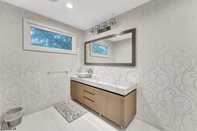 41 Park Way W, Orange Twp, NJ 07052 - bathroom with wallpapered walls, vanity, baseboards, and tile patterned flooring
