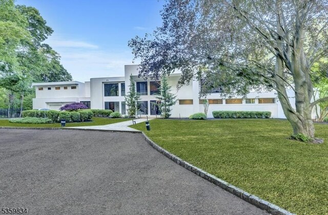 41 Park Way W, Orange Twp, NJ 07052 - view of front of home with stucco siding and a front lawn