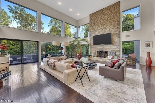 41 Park Way W, Orange Twp, NJ 07052 - living area featuring a high ceiling, plenty of natural light, a stone fireplace, recessed lighting, and wood finished floors