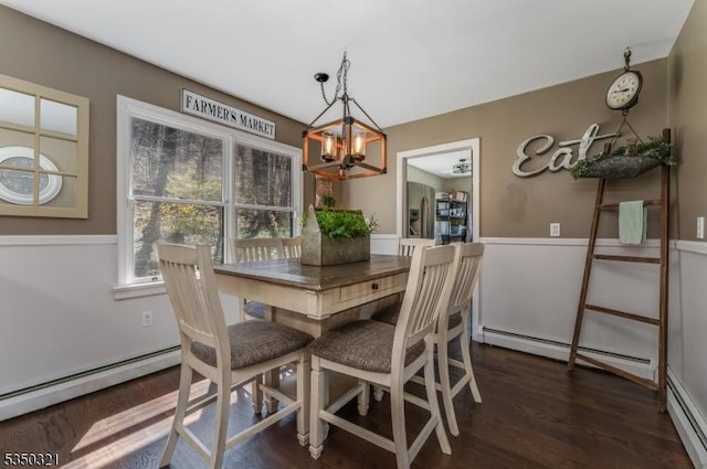192 Mountain Rd, Pohatcong Twp, NJ 08865 - dining space with a chandelier, a baseboard heating unit, and dark wood-style flooring