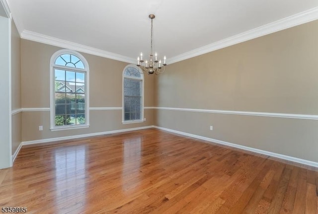 28 Lavada Ln, Raritan Twp, NJ 08551 - unfurnished room with a chandelier, light wood-style flooring, baseboards, and ornamental molding