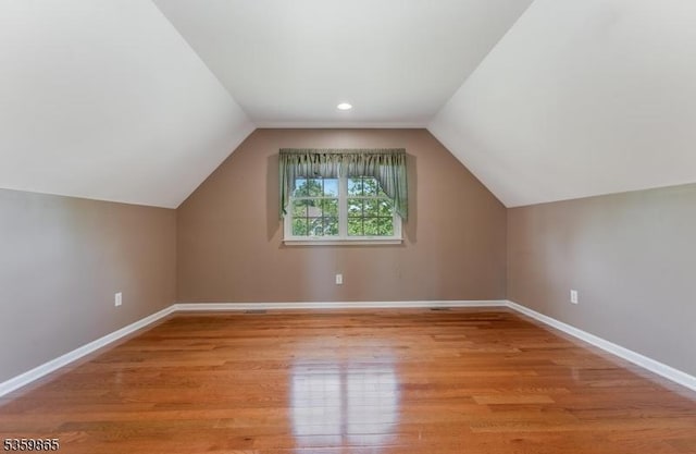 28 Lavada Ln, Raritan Twp, NJ 08551 - additional living space with baseboards, light wood-type flooring, and lofted ceiling
