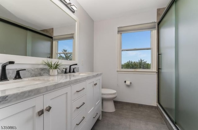 28 Lavada Ln, Raritan Twp, NJ 08551 - full bath with double vanity, toilet, a shower with door, and baseboards
