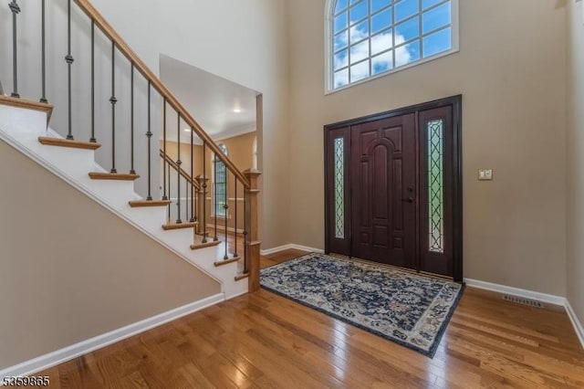 28 Lavada Ln, Raritan Twp, NJ 08551 - foyer entrance with a towering ceiling, wood finished floors, baseboards, and stairway