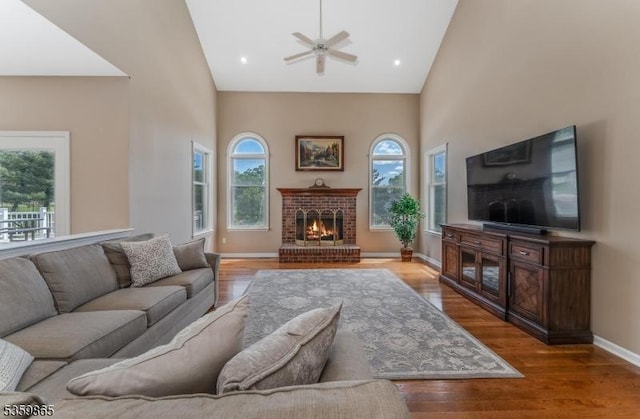 28 Lavada Ln, Raritan Twp, NJ 08551 - living area with high vaulted ceiling, a ceiling fan, wood finished floors, a fireplace, and baseboards