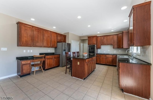 28 Lavada Ln, Raritan Twp, NJ 08551 - kitchen with stainless steel appliances, a sink, a center island, a kitchen breakfast bar, and decorative backsplash