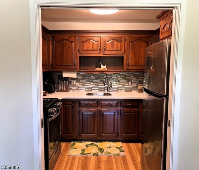25 Osprey Cg310, Allamuchy Twp, NJ 07840 - kitchen featuring freestanding refrigerator, a sink, gas stove, and light countertops
