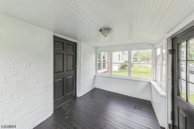 10 N Clark St, Ogdensburg Boro, NJ 07439 - unfurnished sunroom featuring wood finished floors, wooden ceiling, and brick wall