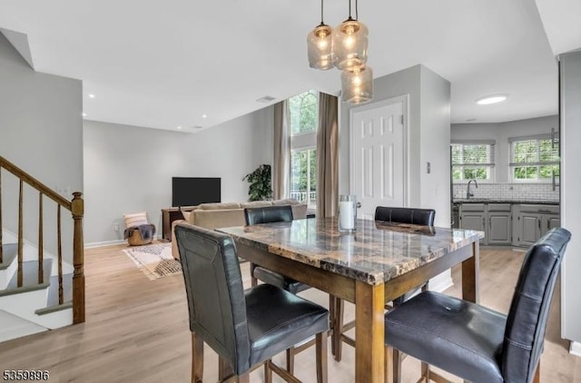 65 Academy Ct, Bedminster Twp, NJ 07921 - dining space with plenty of natural light, light wood-style floors, and stairway