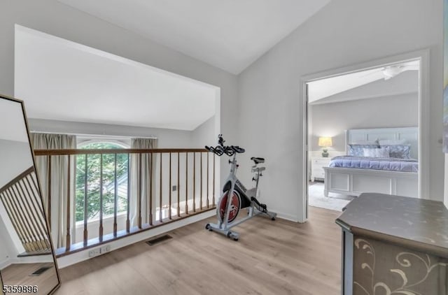 65 Academy Ct, Bedminster Twp, NJ 07921 - workout area with vaulted ceiling and wood finished floors
