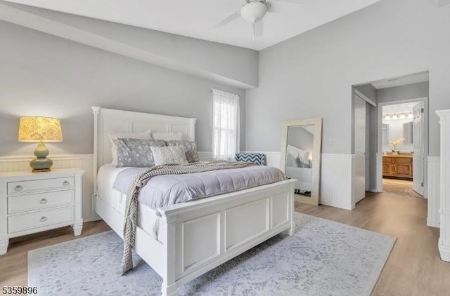 65 Academy Ct, Bedminster Twp, NJ 07921 - bedroom with a wainscoted wall, light wood finished floors, ensuite bath, lofted ceiling, and ceiling fan