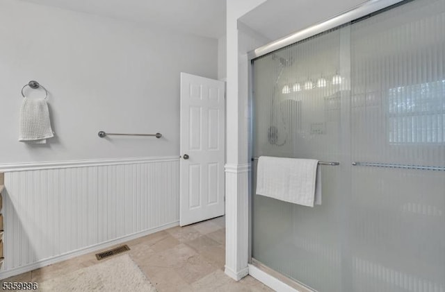 65 Academy Ct, Bedminster Twp, NJ 07921 - bathroom featuring a shower stall and a wainscoted wall