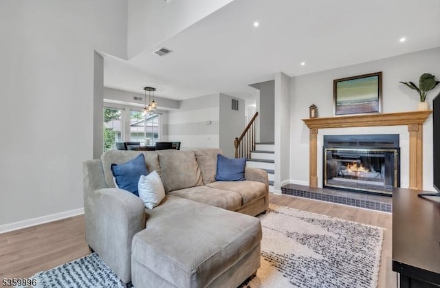65 Academy Ct, Bedminster Twp, NJ 07921 - living room with wood finished floors, baseboards, stairway, a fireplace, and recessed lighting