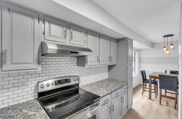 65 Academy Ct, Bedminster Twp, NJ 07921 - kitchen featuring electric range, under cabinet range hood, tasteful backsplash, light wood finished floors, and light stone counters