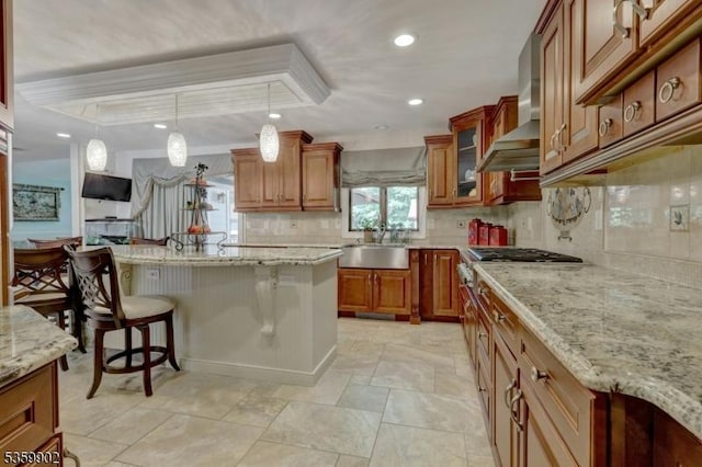 24 Partridge Run, Montvale Boro, NJ 07645 - kitchen with a sink, a breakfast bar, brown cabinets, decorative backsplash, and recessed lighting