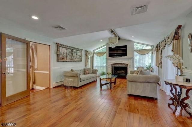 24 Partridge Run, Montvale Boro, NJ 07645 - living room with a fireplace, light wood finished floors, a baseboard radiator, baseboards, and recessed lighting