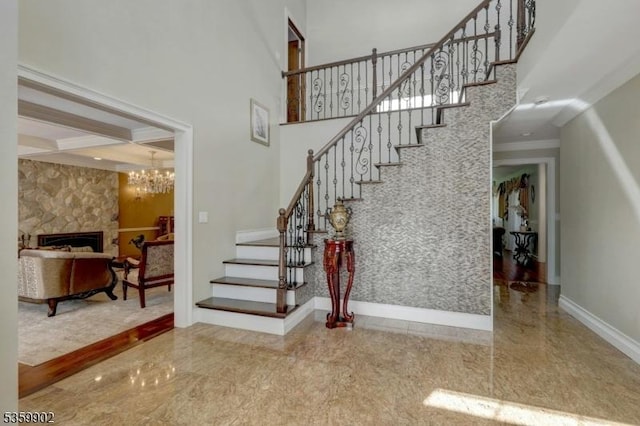 24 Partridge Run, Montvale Boro, NJ 07645 - stairway featuring baseboards, crown molding, and a stone fireplace