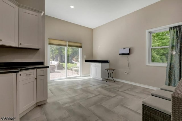 24 Partridge Run, Montvale Boro, NJ 07645 - kitchen with baseboards, healthy amount of natural light, dark countertops, recessed lighting, and white cabinets