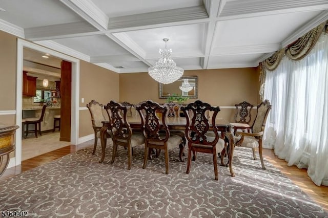 24 Partridge Run, Montvale Boro, NJ 07645 - dining space featuring a chandelier, coffered ceiling, beam ceiling, wood finished floors, and baseboards