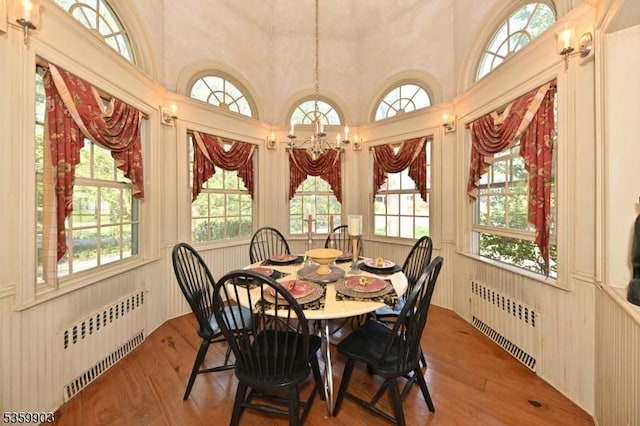 777 E Ridgewood Ave, Ridgewood Village, NJ 07450 - dining area with radiator heating unit, healthy amount of natural light, a chandelier, and a towering ceiling