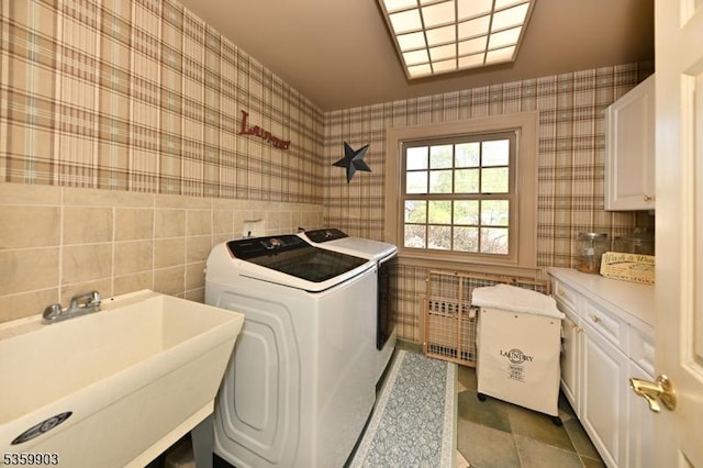 777 E Ridgewood Ave, Ridgewood Village, NJ 07450 - laundry area with cabinet space, washing machine and clothes dryer, wallpapered walls, tile walls, and tile patterned flooring