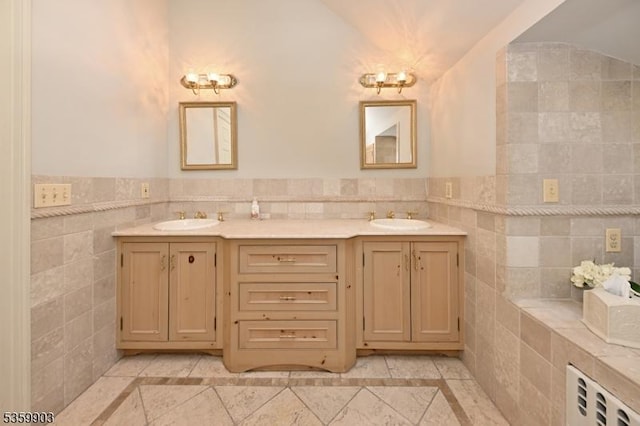 777 E Ridgewood Ave, Ridgewood Village, NJ 07450 - full bathroom featuring inlaid floor details, tile walls, double vanity, and a wainscoted wall